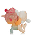 The tokidoki x Cinnamoroll Sweet Treats - Cinnamoroll x Mango'licious (Special Edition) by tokidoki (IT) features a pastel unicorn-mermaid with a pink mane, swirled horn, donut detail, and narwhal plush—perfect for sweet treat lovers.