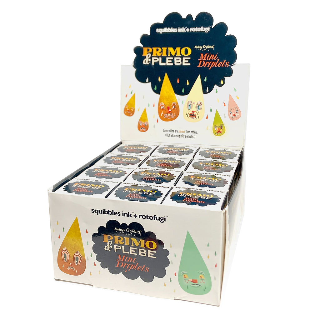 A display box features Squibbles Ink + Rotofugi (US)'s Mini Driplets — Primo & Plebe Blind Box. The box showcases multiple small boxes adorned with Travis Lampe's illustrative tear drip characters.