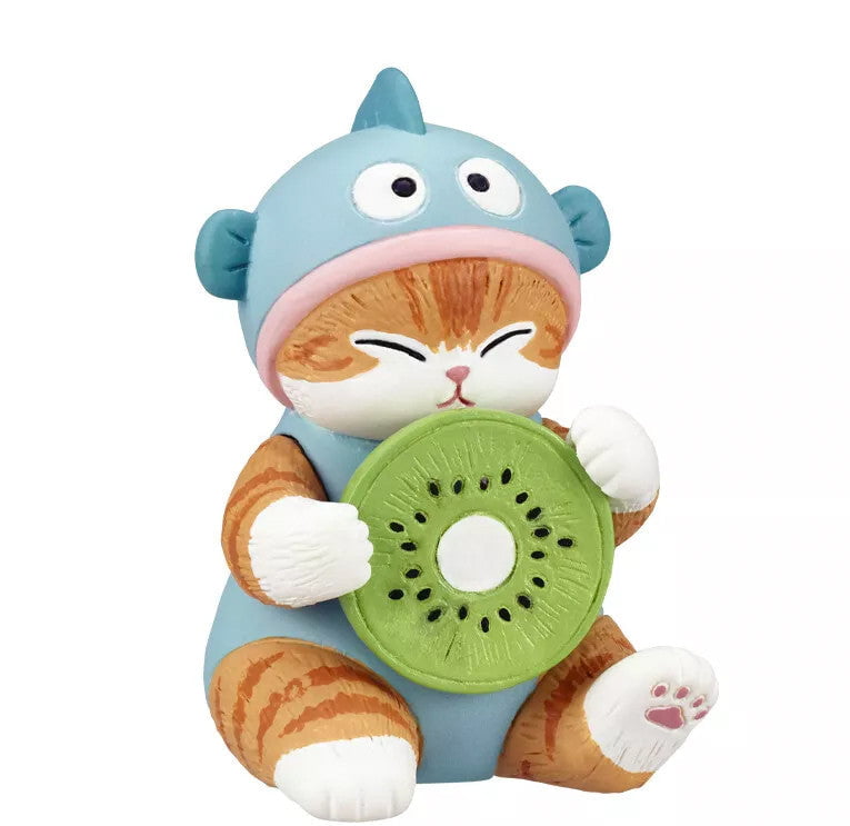 A Mofusand x Sanrio Series 2 capsule figurine by Kitan Club (JP), featuring an orange tabby cat in a blue costume holding a kiwi slice, set against a white background.