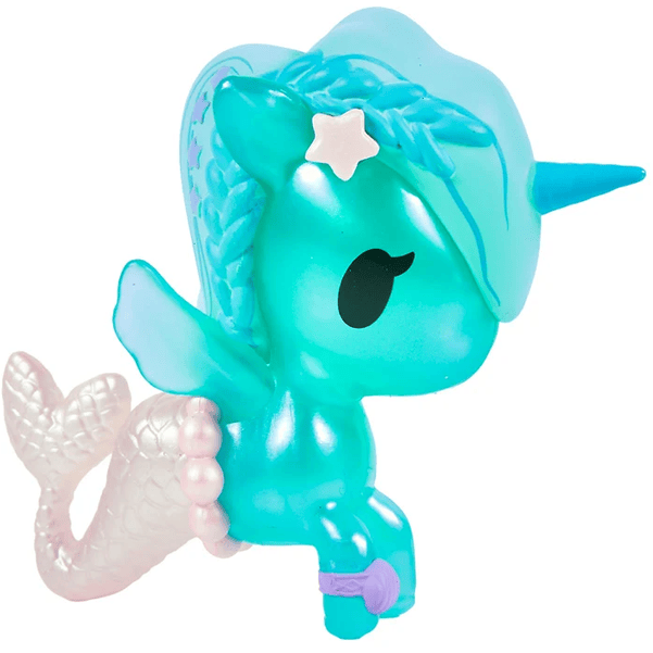 Introducing the Magical Tides Mermicorno Tokidoki by tokidoki—a whimsical turquoise toy figure blending unicorn and mermaid features. Adorned with a star on its head, a blue horn, shimmering mermaid tail, and delicate beads around its body, this figure enchants with black eyes and soft pastel hues. Radiating ocean-inspired charm, it’s perfect for fans of underwater adventures and collectors of the magical Mermicorno Blind Box series.