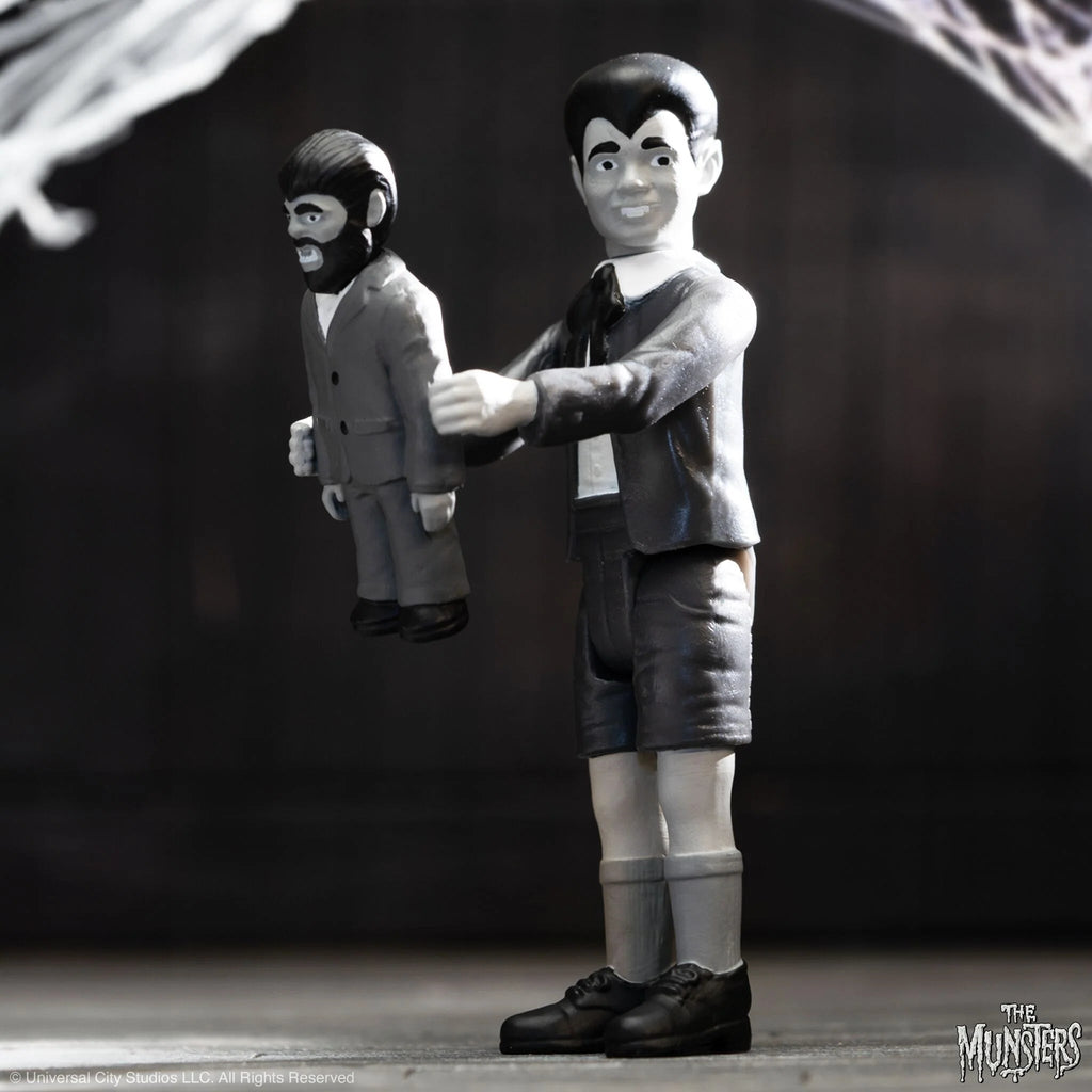 An Eddie Munster ReAction figure of a man and a woman holding a spider from The Munsters ReAction - Eddie by Super 7.