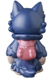 The Ookamikun — VAG 10th Anniversary vinyl toy by Medicom (JP), a blue wolf-like figure with a pink backpack, is shown from behind.