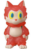 Standing upright, the Medicom (JP) Ookamikun — VAG 10th Anniversary is a red cartoon-style cat figurine with yellow and blue eyes, a white face and belly, and a scarf-like collar, inspired by Japanese vinyl toy design.
