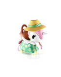 Add the Tokidoki Picnic Party Unicorno Blind Box by tokidoki (IT) to your collection—featuring a charming toy bird in a green dress with daisies, straw hat, and brown basket. Perfect for fans of collectible figures and tokidoki surprises!.