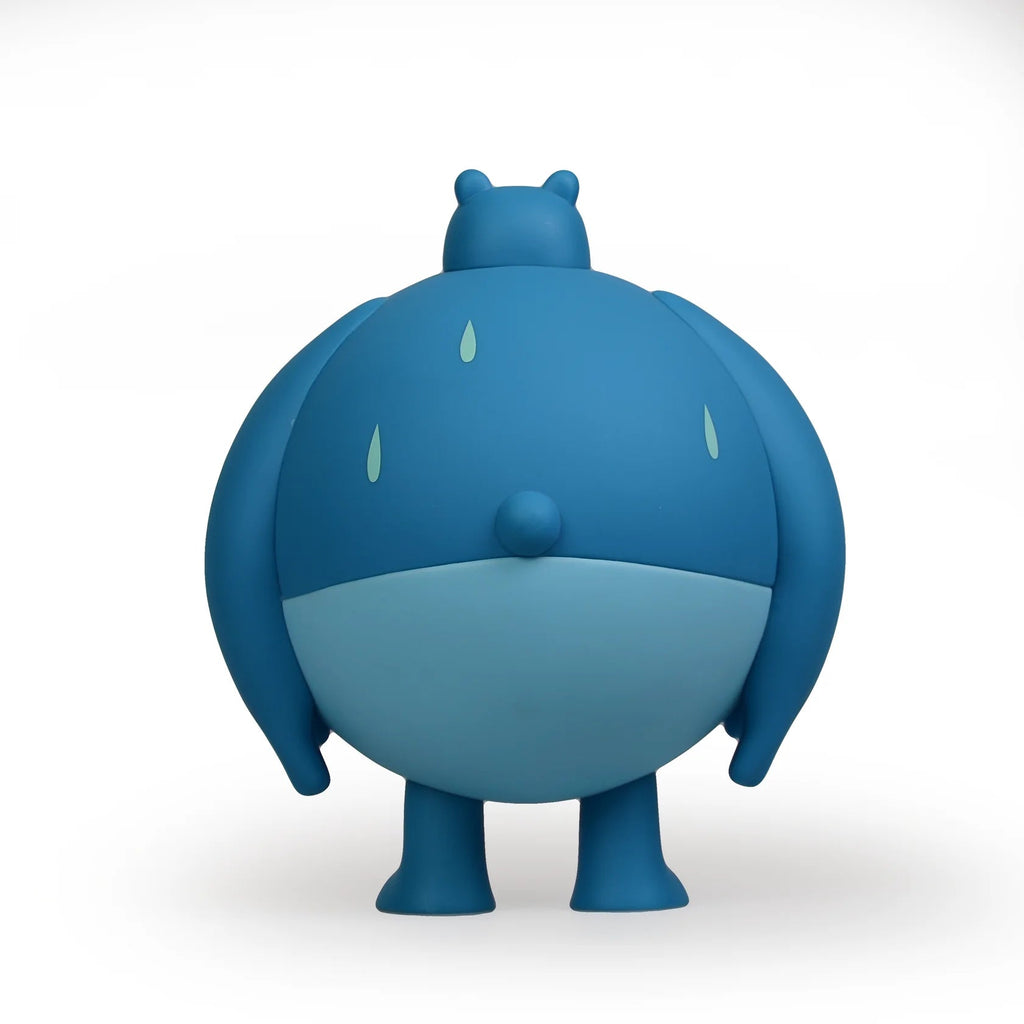A blue Sugar Booger Vinyl Figure with a raindrop on it by Heavy Cream.