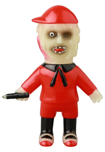 The VAG 42 - Toromikun by Yoshimoto Kogyo from Medicom (JP) is a vinyl figure with a distorted face, red cap and outfit with black accents, holding a black objectâuniquely inspired by Japanese toy artists and gachapon figures.