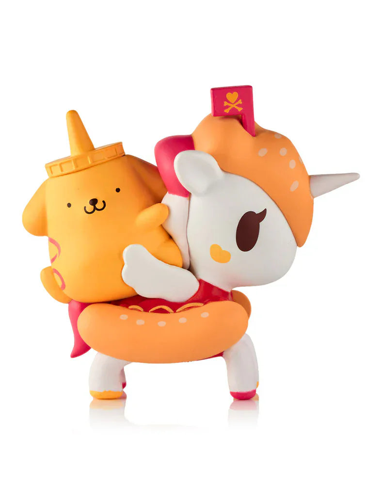 A cute unicorn figure with an orange donut mane carries a yellow dog toy with a bottle cap, both in cartoon style, from the Tokidoki x Hello Kitty & Friends Fast Food Blind Box by tokidoki (IT), shown against a white background.