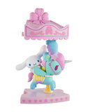 A cute figurine from the tokidoki x Hello Kitty and Friends Sweet Pink Carousel Blind Box, featuring Cinnamoroll on a pastel carousel horse with a pink canopy—perfect for Sanrio fans and collectors of tokidoki surprises.