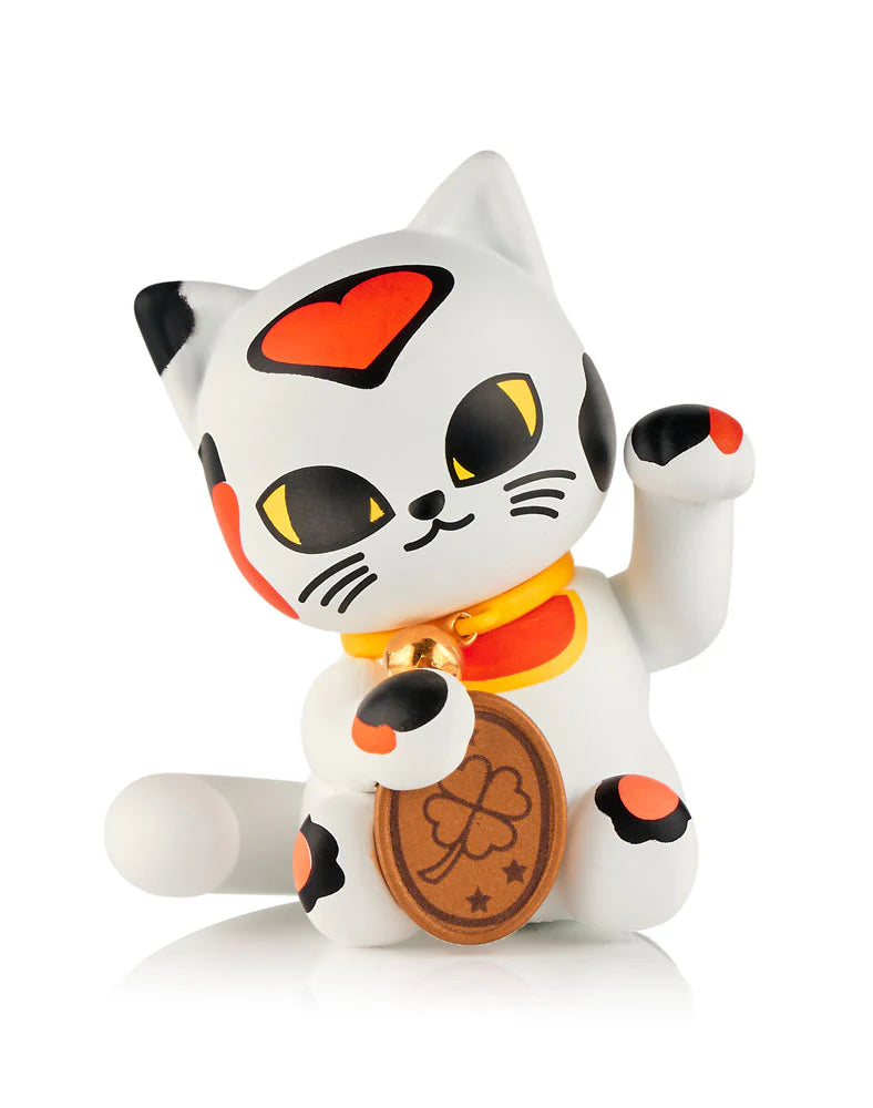 A charming white cat figurine with black and red spots, yellow eyes, gold collar, and clover coin—an adorable collectible from the tokidoki (IT) Tokidoki Lucky Cats Blind Box series.