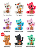 Nine vibrant collectible Maneki Neko figures by tokidoki (IT), each with a distinct name and color, are arranged in a 3x3 grid. In the bottom left position sits the gold