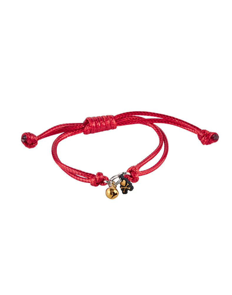 The Tokidoki Lucky Cats - Eternal Lucky Paws (Special Edition) by tokidoki (IT) is a red adjustable bracelet with a gold bell and black four-leaf clover charm, inspired by Lucky Cat motifs for added good fortune.