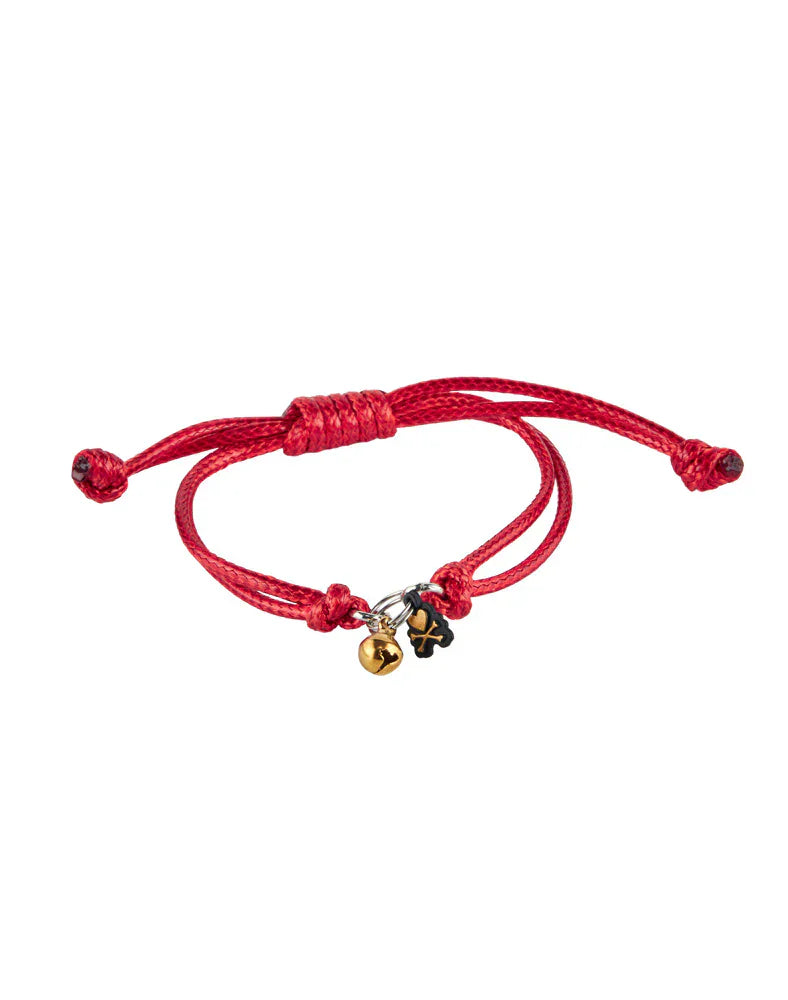 The Tokidoki Lucky Cats - Eternal Lucky Paws (Special Edition) by tokidoki (IT) is a red adjustable bracelet with a gold bell and black four-leaf clover charm, inspired by Lucky Cat motifs for added good fortune.