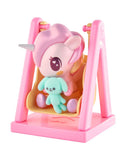 The tokidoki Baby Unicorno - Swingin' Baby Bunny (Special Edition) features a magical plush bunny on a yellow swing with a pink frame, adding charm and whimsy to any collection.