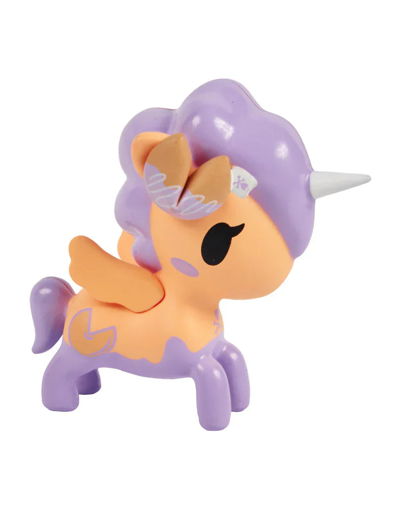 The Tokidoki Fortune Cookie Unicorno Blind Box features a whimsical orange and purple unicorn with wings, a silver horn, and a purple mane—perfect as a surprise figure for any Blind Box collection.