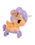 The Tokidoki Fortune Cookie Unicorno Blind Box features a whimsical orange and purple unicorn with wings, a silver horn, and a purple mane—perfect as a surprise figure for any Blind Box collection.