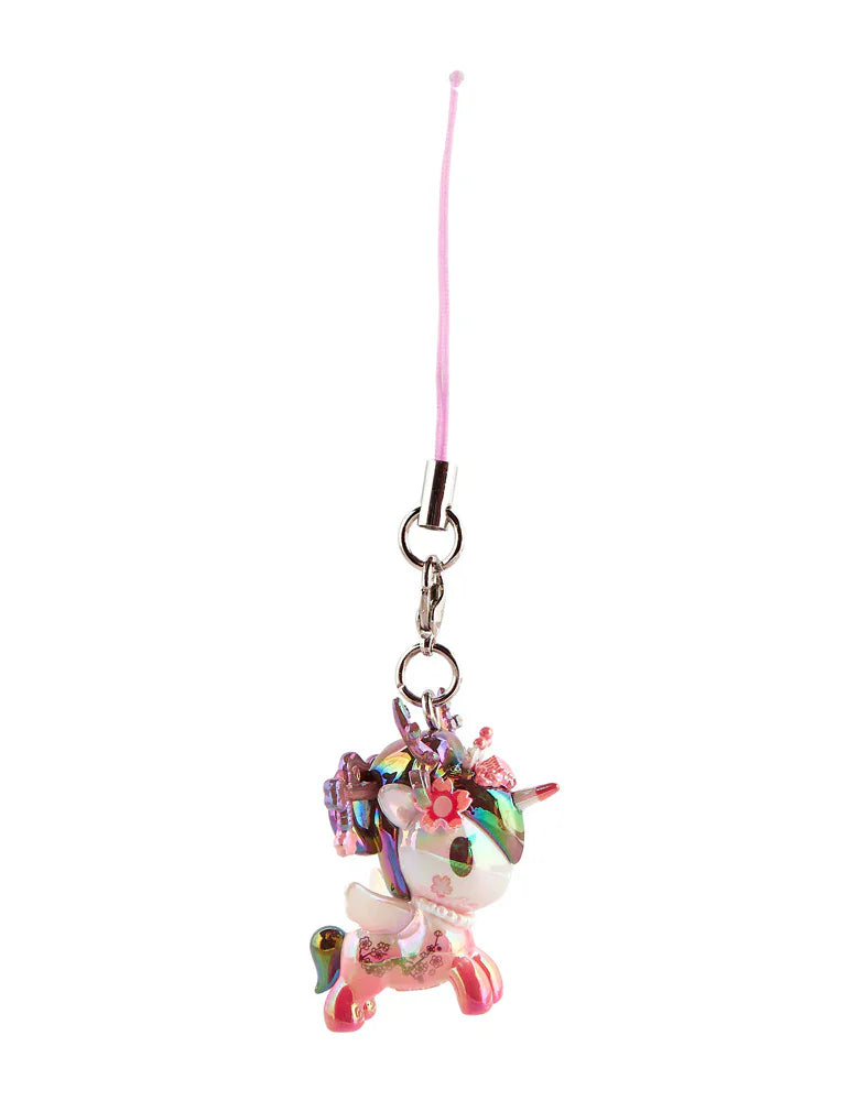 The Tokidoki Shimmer Cherry Blossom Unicorno Frenzies Blind Box keychain features a small, floral-designed Unicorno with a pink strap—an adorable collectible from tokidoki, shown against a white background.