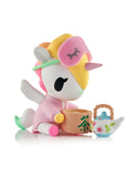 Add kawaii wellness to your space with Tokidoki's Spa Day Unicorno Blind Box, featuring a pastel-colored Unicorno in a pink robe and sleep mask, sitting with a teacup and floral teapot on a crisp white background.