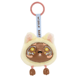 A Kaleidos Creative Widdle Baby Big World Bag Clip Blind Box keychain featuring a round toy with a brown face, big eyes decorated with flowers, small cat ears, tiny feet, a blue ribbon, and a pink keyring.
