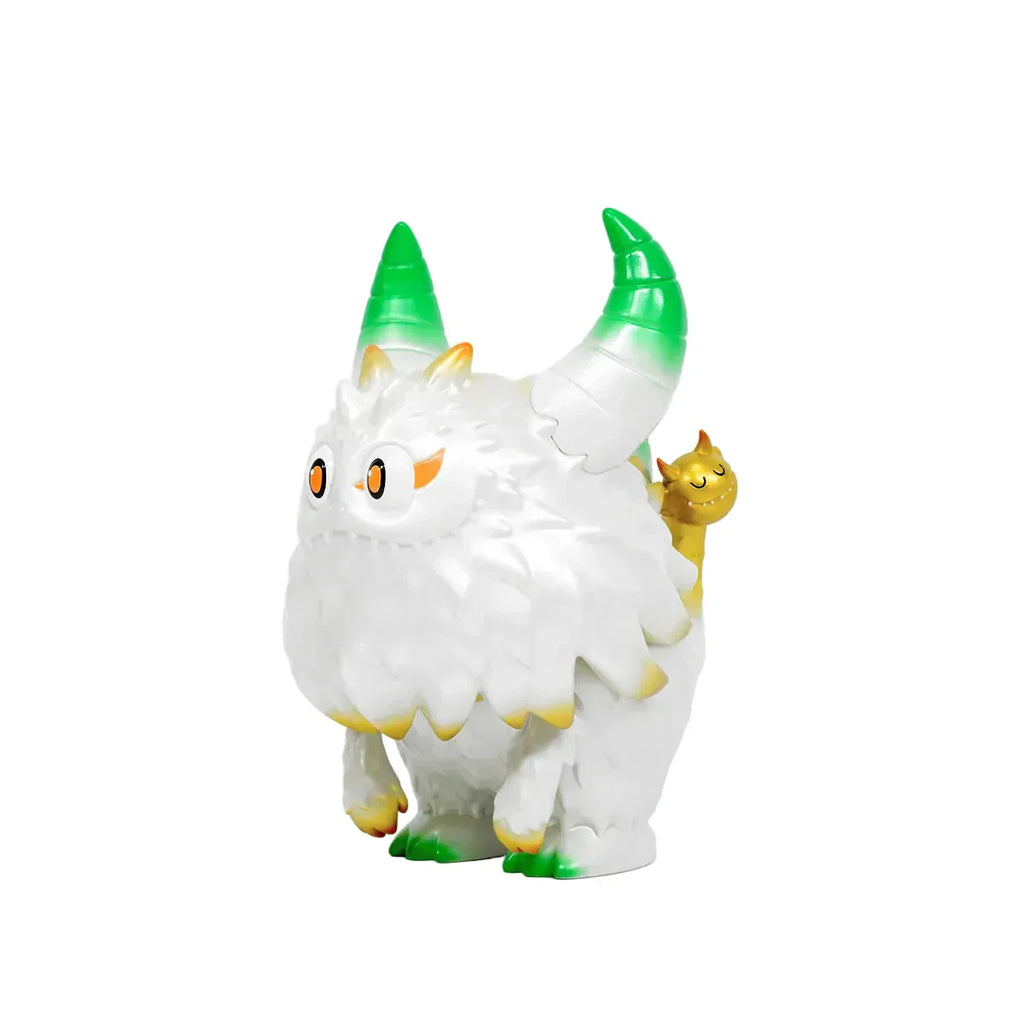 The Little Hut (HK) Rangeas Rex Jr. — White & Gold is a collectible toy showing a furry, horned creature with green-tipped horns and feet, orange eyes, and a small yellow cat-like figure on its back against a white background.