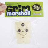 A hand holds a packaged