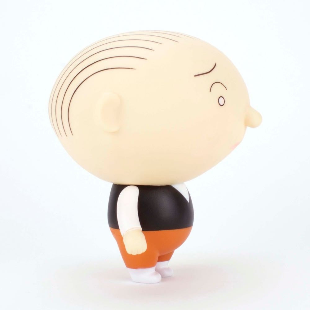 The Jimmy Corrigan Vital Animus Vinyl Doll by Presspop (JP) features a large bald head, black striped hair, black vest, white shirt, orange pants, and white shoes—capturing Chris Ware’s iconic style in side profile against a white background.