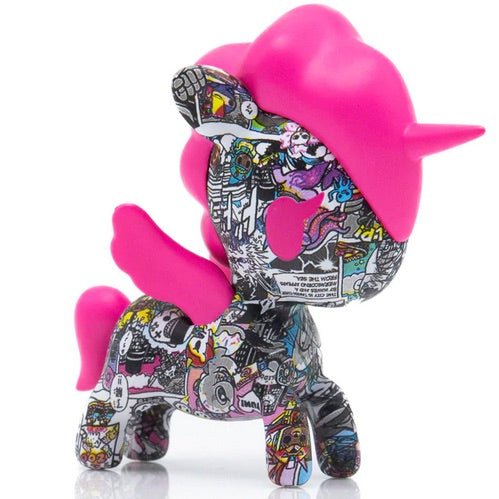 A pink unicorn toy with tokidoki's Manga Mania Unicorno Blind Box comics.