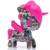 A pink unicorn toy with tokidoki's Manga Mania Unicorno Blind Box comics.