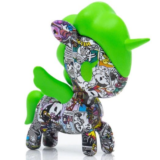 A green Manga Mania Unicorno Blind Box toy covered in tokidoki stickers.