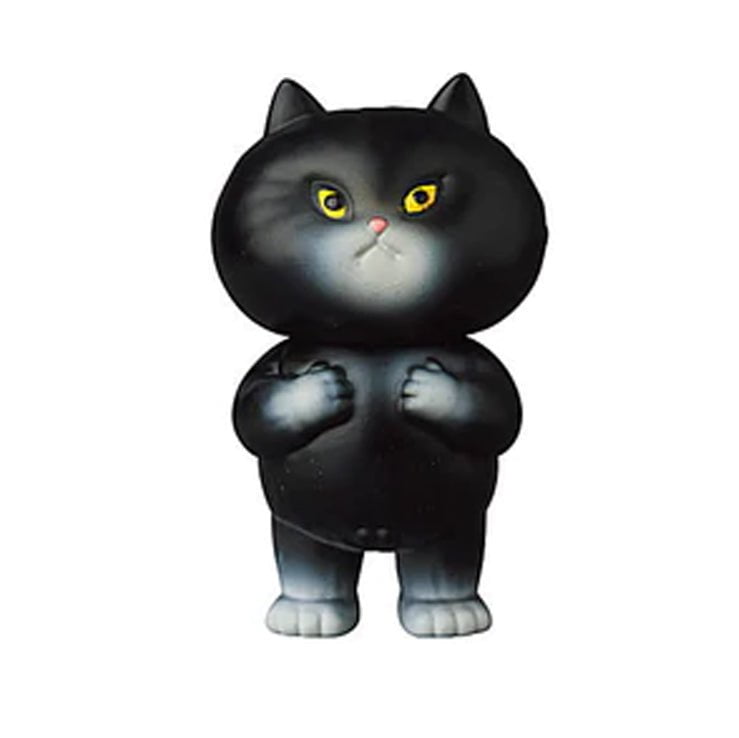 A black cat with yellow eyes is featured on a white background, reminiscent of Japanese vinyl toys like the VAG 29 — Futekoneko by Medicom (JP).