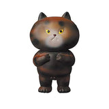 A Medicom (JP) VAG 29 — Futekoneko vinyl toy cat with yellow eyes is standing on a white background.