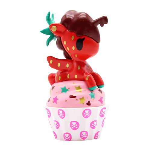 A dessert-themed tokidoki Delicious Unicorno Blind Box toy unicorn perched atop a cupcake.