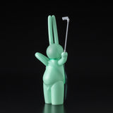 A Japanese vinyl bunny, The Daily Flasher by mr. clement, is depicted holding a golf club. Created by Tomenosuke Shoten (JP).