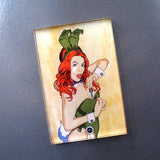 A Rotofugi refrigerator magnet featuring a woman with red hair, inspired by the Brian Ewing Playboy Redux exhibit.