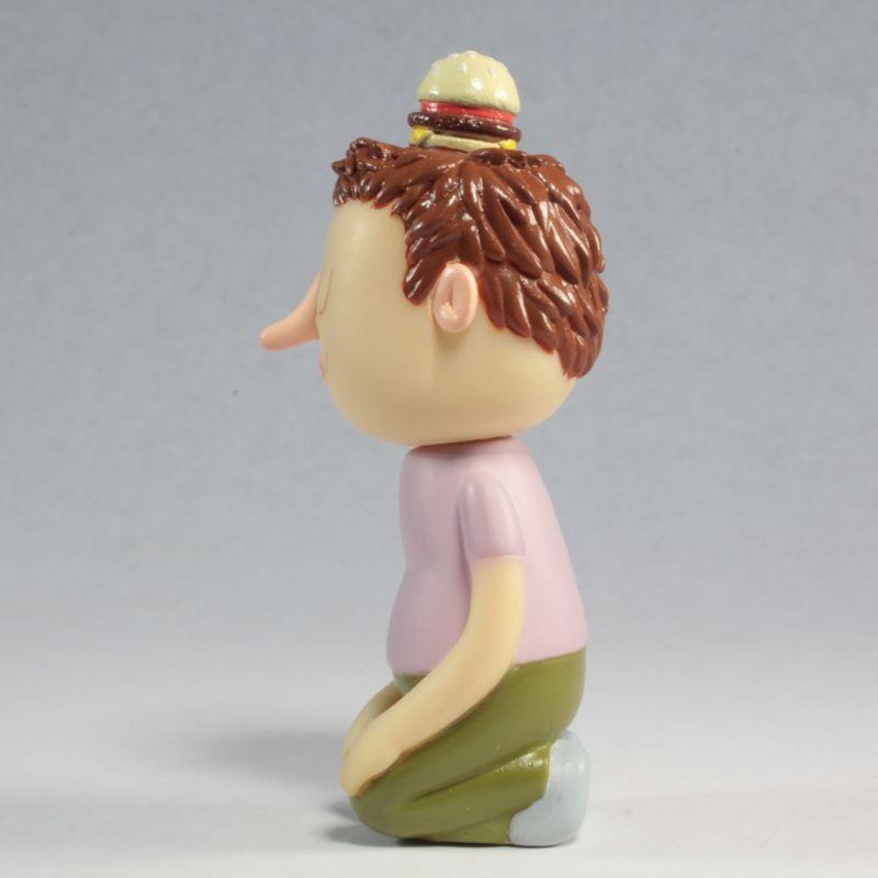A sculpture of a man with a Tinder Toys: Boyger hat, created by an artist from Squibbles Ink + Rotofugi (US).