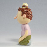 A sculpture of a man with a Tinder Toys: Boyger hat, created by an artist from Squibbles Ink + Rotofugi (US).