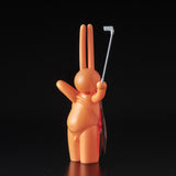 A Daily Flasher toy rabbit holding a Golf club designed by Mr. Clement in Japanese vinyl by Tomenosuke Shoten (JP).