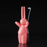 A pink bunny holding a golf club, designed by Mr. Clement in Japanese vinyl - The Daily Flasher by Tomenosuke Shoten (JP).