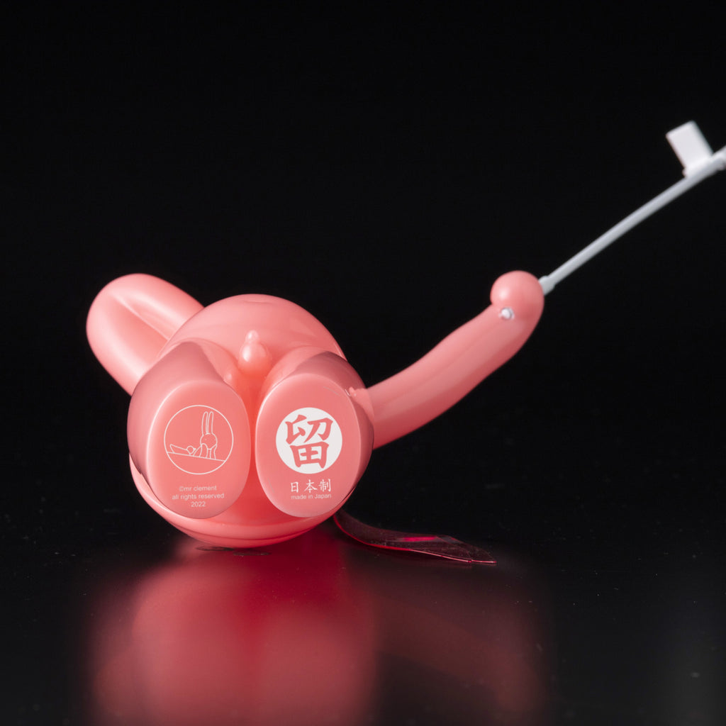 A pink plastic toy with a handle, The Daily Flasher by mr. clement.