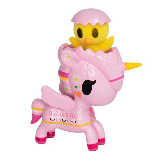 An Easter Pio Pio Unicorno toy with a duck on top of it. (tokidoki)