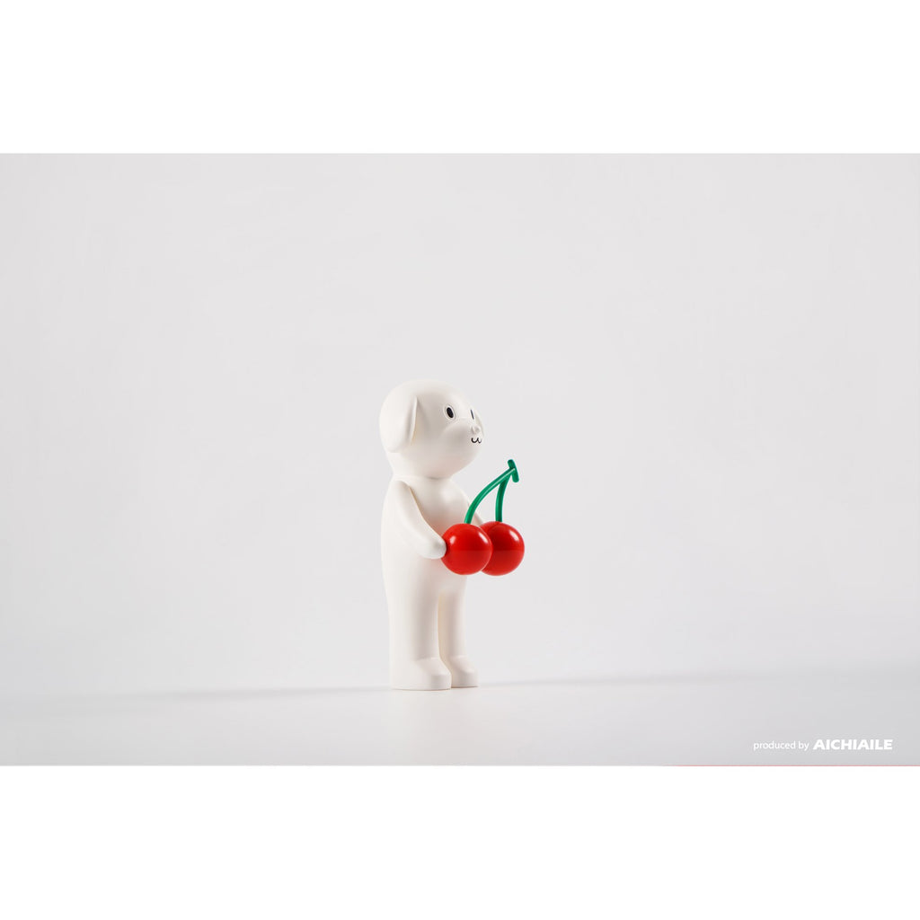A Puppy Tang F2 resin figure holding a cherry on a white background, limited edition by AICHIAILE (CN).