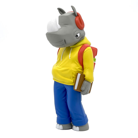 A Rumpus figurine of a rhino wearing a hoodie and carrying a book by UVD Toys.