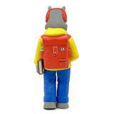 A Rumpus toy figure with a backpack designed by Scribe manufactured by UVD Toys.