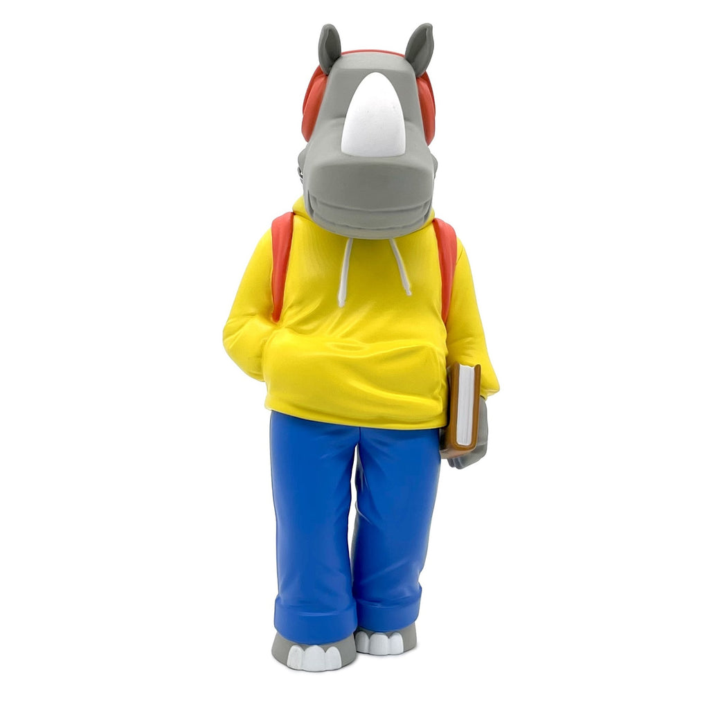 A quirky statue of Rumpus, a rhino donning a hat and holding a book, created by UVD Toys.