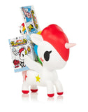 A tokidoki Unicorno Series 11 Blind Box collector's toy unicorn is holding a box of candy.