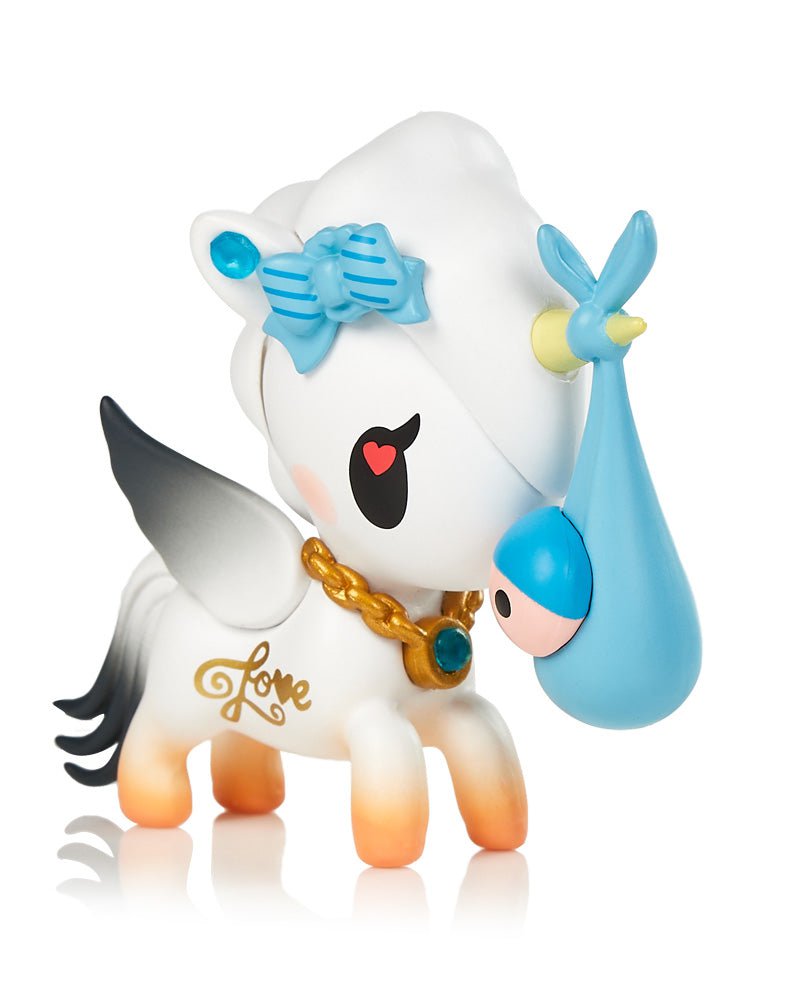 A collector's Unicorno Series 11 Blind Box toy from tokidoki with a blue bow on its head.