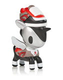 A small toy from the Unicorno Series 11 Blind Box by tokidoki with a pair of shoes on it.