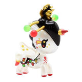 A toy unicorn with a hat on its head from the Holiday Unicorno Series 3 Blind Box by tokidoki.