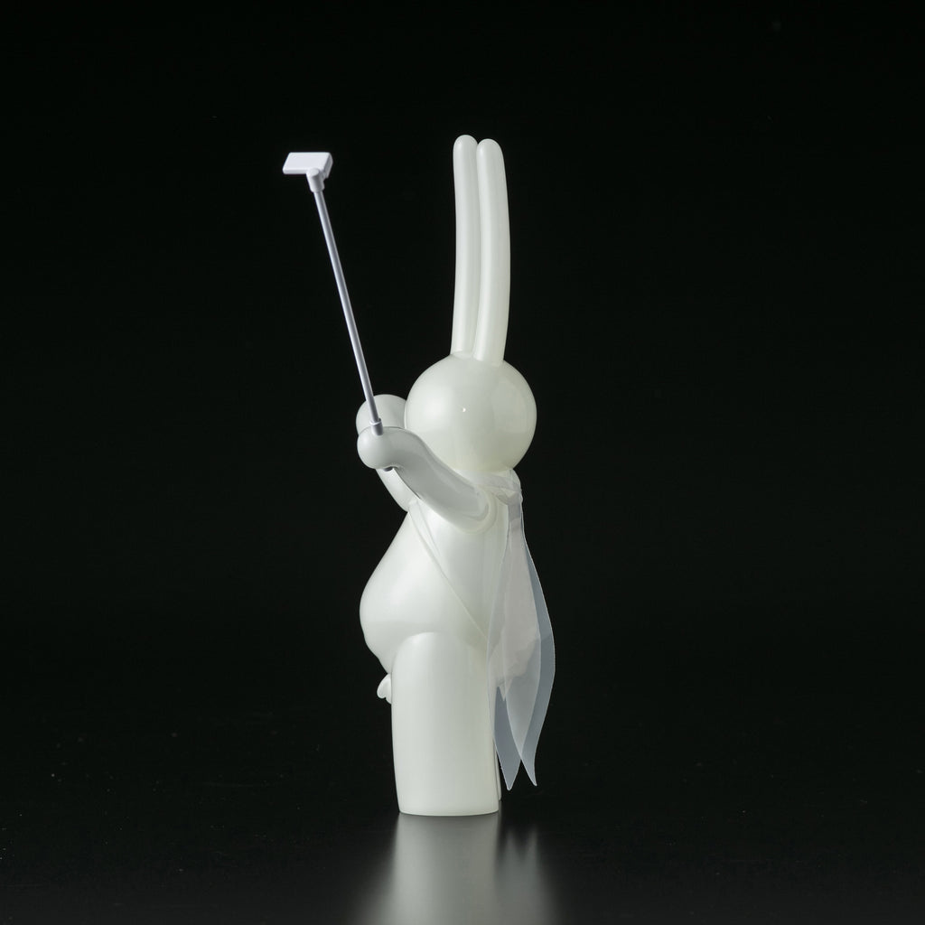 A white Daily Flasher figurine of a rabbit holding a golf club by Tomenosuke Shoten (JP).