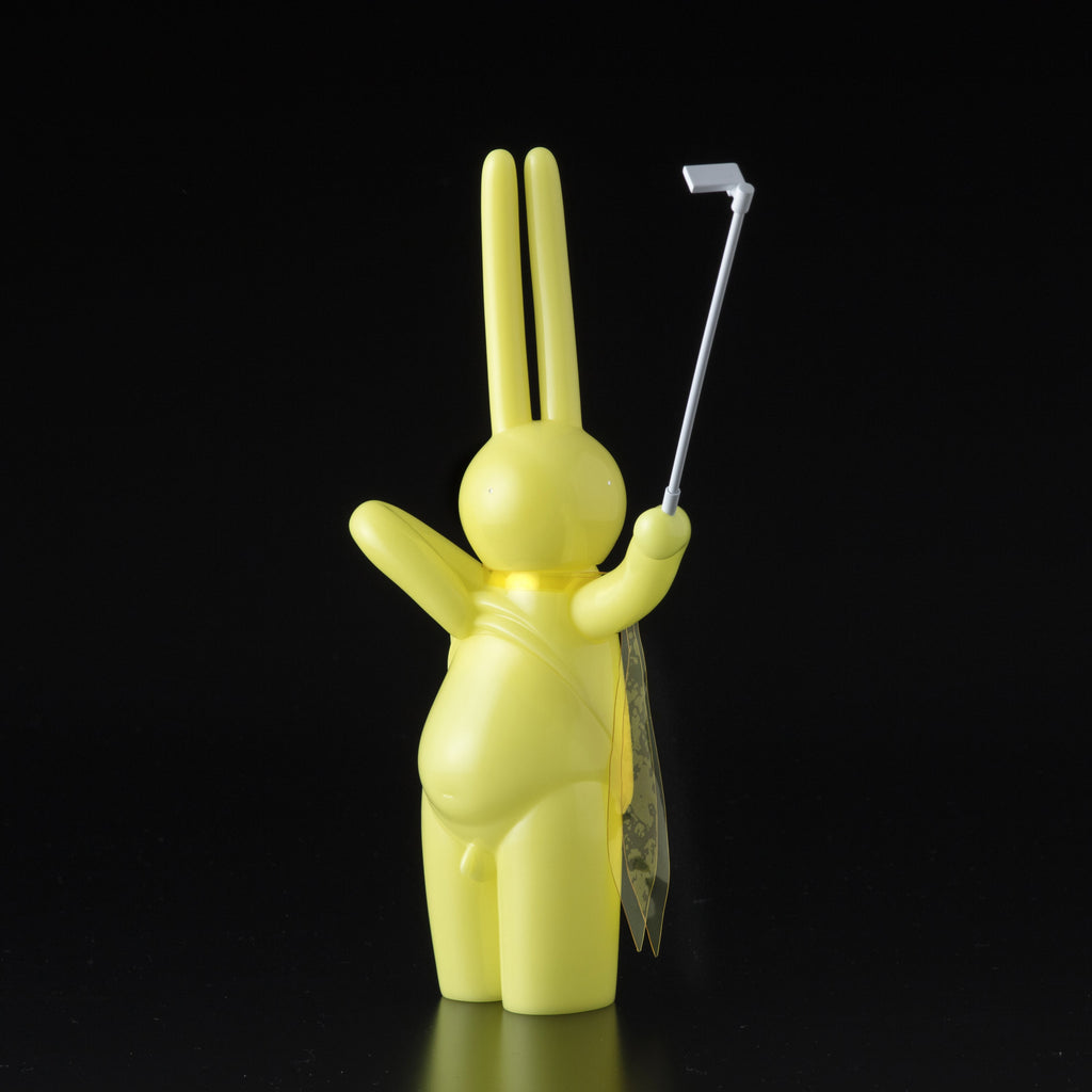 A yellow bunny, created by Japanese vinyl artist Mr. Clement and Tomenosuke Shoten (JP), holds The Daily Flasher.