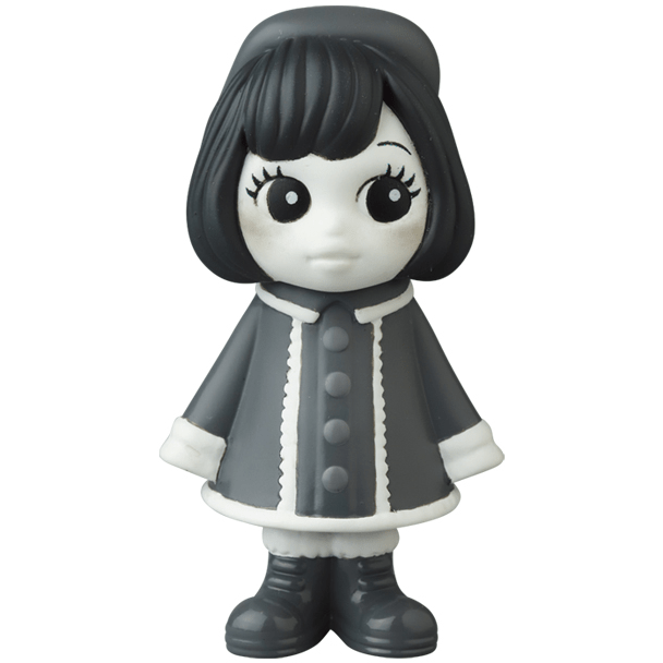 A black and white figurine of a girl wearing a coat, inspired by Japanese vinyl toy artists, the VAG 31 β Uramy and Tsurami by Medicom (JP).
